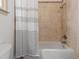 Bathroom with a tiled shower and bathtub combo at 187 Vanira Se Ave, Atlanta, GA 30315