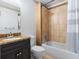 Bathroom featuring a vanity with a granite countertop, toilet, and a tiled shower and tub combo at 187 Vanira Se Ave, Atlanta, GA 30315