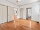 Spacious bedroom features neutral colors, closet space, and hardwood floors at 187 Vanira Se Ave, Atlanta, GA 30315