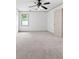 Bright bedroom featuring neutral carpet, baseboards, and ceiling fan providing comfortable climate control at 187 Vanira Se Ave, Atlanta, GA 30315