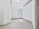 Empty bedroom featuring neutral carpet, white walls, and gray trim at 187 Vanira Se Ave, Atlanta, GA 30315