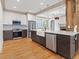 Bright kitchen boasts stainless appliances, white and gray cabinetry, with farm sink at 187 Vanira Se Ave, Atlanta, GA 30315