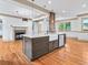 Kitchen island with quartz countertops, stainless steel appliances, and farmhouse sink at 187 Vanira Se Ave, Atlanta, GA 30315