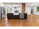 Kitchen island boasts stainless appliances, farm sink, with open floor plan at 187 Vanira Se Ave, Atlanta, GA 30315