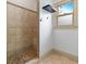 Shower features stylish tile and a window for natural light at 187 Vanira Se Ave, Atlanta, GA 30315