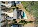 Aerial view of estate with manicured lawn, circular drive, pool, and mature trees at 3185 Casteel Ne Rd, Marietta, GA 30062