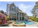 Beautiful backyard features a swimming pool, hot tub, covered porch and multi-level patio at 3185 Casteel Ne Rd, Marietta, GA 30062
