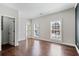 Bright bedroom features hardwood floors, white trim, two windows with great natural light, and a closet at 3185 Casteel Ne Rd, Marietta, GA 30062