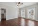 Neutral bedroom features hardwood floors, two windows and adjacent walk-in closet at 3185 Casteel Ne Rd, Marietta, GA 30062