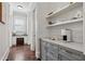 Charming butler's pantry with built-in shelving, custom cabinetry, and a coffee station at 3185 Casteel Ne Rd, Marietta, GA 30062