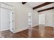 Bright hallway features hardwood floors, white trim, and striking ceiling beams at 3185 Casteel Ne Rd, Marietta, GA 30062