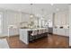 Spacious kitchen featuring a large center island, stainless steel appliances, and pendant lighting at 3185 Casteel Ne Rd, Marietta, GA 30062