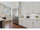 Bright kitchen showcases a stainless steel refrigerator, white cabinets, and subway tile backsplash at 3185 Casteel Ne Rd, Marietta, GA 30062