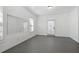 Bright living room featuring white walls, large mirror, and natural light at 3185 Casteel Ne Rd, Marietta, GA 30062