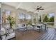 Relaxing screened-in porch with comfortable seating, dining area, and scenic views of the surrounding trees at 3185 Casteel Ne Rd, Marietta, GA 30062