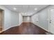 Open basement area with wood floors, white ceiling tiles and light gray walls, and multiple windows at 4146 Mcever Park Dr, Acworth, GA 30101