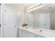 A bathroom featuring double sinks, a large mirror, vanity lights, and modern fixtures at 4146 Mcever Park Dr, Acworth, GA 30101