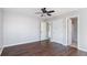 Hardwood floor bedroom with ceiling fan, a bathroom, and two doors for easy access at 4146 Mcever Park Dr, Acworth, GA 30101