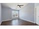 Spacious bedroom features hardwood floors, ceiling fan, a large window, and ample natural light at 4146 Mcever Park Dr, Acworth, GA 30101