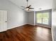 Bright bedroom features hardwood floors, ceiling fan, a large window, and ample space at 4146 Mcever Park Dr, Acworth, GA 30101