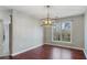 Bright dining area featuring hardwood floors, natural light, and a contemporary chandelier, ideal for entertaining guests and Gathering dinners at 4146 Mcever Park Dr, Acworth, GA 30101