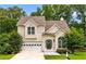 Charming two-story home featuring a well-maintained lawn, attached garage, and inviting front entrance, perfect for suburban living at 4146 Mcever Park Dr, Acworth, GA 30101