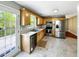 Spacious kitchen featuring modern appliances, light wood cabinetry, and a patio entrance, ideal for indoor-outdoor living and entertaining at 4146 Mcever Park Dr, Acworth, GA 30101