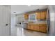 Well-equipped kitchen featuring a stainless steel refrigerator, gas stove, and plentiful cabinets, offering practicality and style at 4146 Mcever Park Dr, Acworth, GA 30101