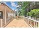 Well-maintained wooden deck provides ample space for outdoor enjoyment and relaxation at 713 S Fairfield Dr, Peachtree City, GA 30269