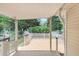 Relaxing covered deck overlooking a private, tree-lined backyard with white picket fencing at 713 S Fairfield Dr, Peachtree City, GA 30269