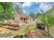 Charming home featuring a spacious wooden deck and professionally landscaped backyard perfect for outdoor gatherings at 713 S Fairfield Dr, Peachtree City, GA 30269