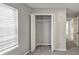 Bedroom with bi-fold closet doors and window at 713 S Fairfield Dr, Peachtree City, GA 30269