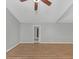 Spacious bedroom with light grey walls, wood-look flooring, and a ceiling fan at 713 S Fairfield Dr, Peachtree City, GA 30269