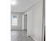 Bedroom featuring window and bi-fold closet doors at 713 S Fairfield Dr, Peachtree City, GA 30269