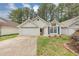 Inviting one-story home with fresh landscaping, attached garage, and cozy facade at 713 S Fairfield Dr, Peachtree City, GA 30269