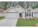 Charming one-story home with a well-manicured lawn, two-car garage and inviting curb appeal at 713 S Fairfield Dr, Peachtree City, GA 30269