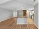 An open floor plan shows a kitchen with granite countertops and stainless appliances at 713 S Fairfield Dr, Peachtree City, GA 30269