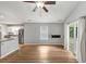 Living room featuring an open concept kitchen and living area with a view of the deck at 713 S Fairfield Dr, Peachtree City, GA 30269