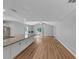 Spacious room featuring hardwood floors, neutral gray walls, a ceiling fan and sliding glass doors at 713 S Fairfield Dr, Peachtree City, GA 30269