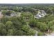 Aerial view of a neighborhood with tree-lined streets and well-maintained homes at 892 Gramercy Hills Ln, Mableton, GA 30126