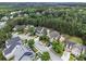 Aerial view of a neighborhood with well-manicured lawns and diverse architectural styles at 892 Gramercy Hills Ln, Mableton, GA 30126