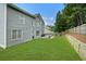 Large backyard featuring a lush lawn, privacy fence, and patio area perfect for entertaining at 892 Gramercy Hills Ln, Mableton, GA 30126