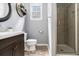Stylish bathroom featuring a walk-in shower, modern vanity, and tasteful decor, creating a serene atmosphere at 892 Gramercy Hills Ln, Mableton, GA 30126
