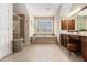 Large bathroom with a soaking tub, a separate glass shower, and dual sink vanity at 892 Gramercy Hills Ln, Mableton, GA 30126