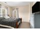 Cozy bedroom features neutral walls, plush carpet, and natural light from the window at 892 Gramercy Hills Ln, Mableton, GA 30126