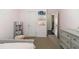 Cozy bedroom with pink walls and carpet, showcasing access to the hallway and closet at 892 Gramercy Hills Ln, Mableton, GA 30126