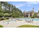 Community pool area features large umbrellas, lounge chairs, and a spa at 892 Gramercy Hills Ln, Mableton, GA 30126