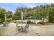 Community pool features patio seating, tables, manicured shrubs, and a calm atmosphere at 892 Gramercy Hills Ln, Mableton, GA 30126