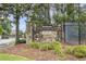 Stone community entrance sign with manicured landscaping and secure gated access at 892 Gramercy Hills Ln, Mableton, GA 30126