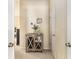 Hallway featuring a rustic cabinet with glass doors and decorative accents, adding charm to the space at 892 Gramercy Hills Ln, Mableton, GA 30126
